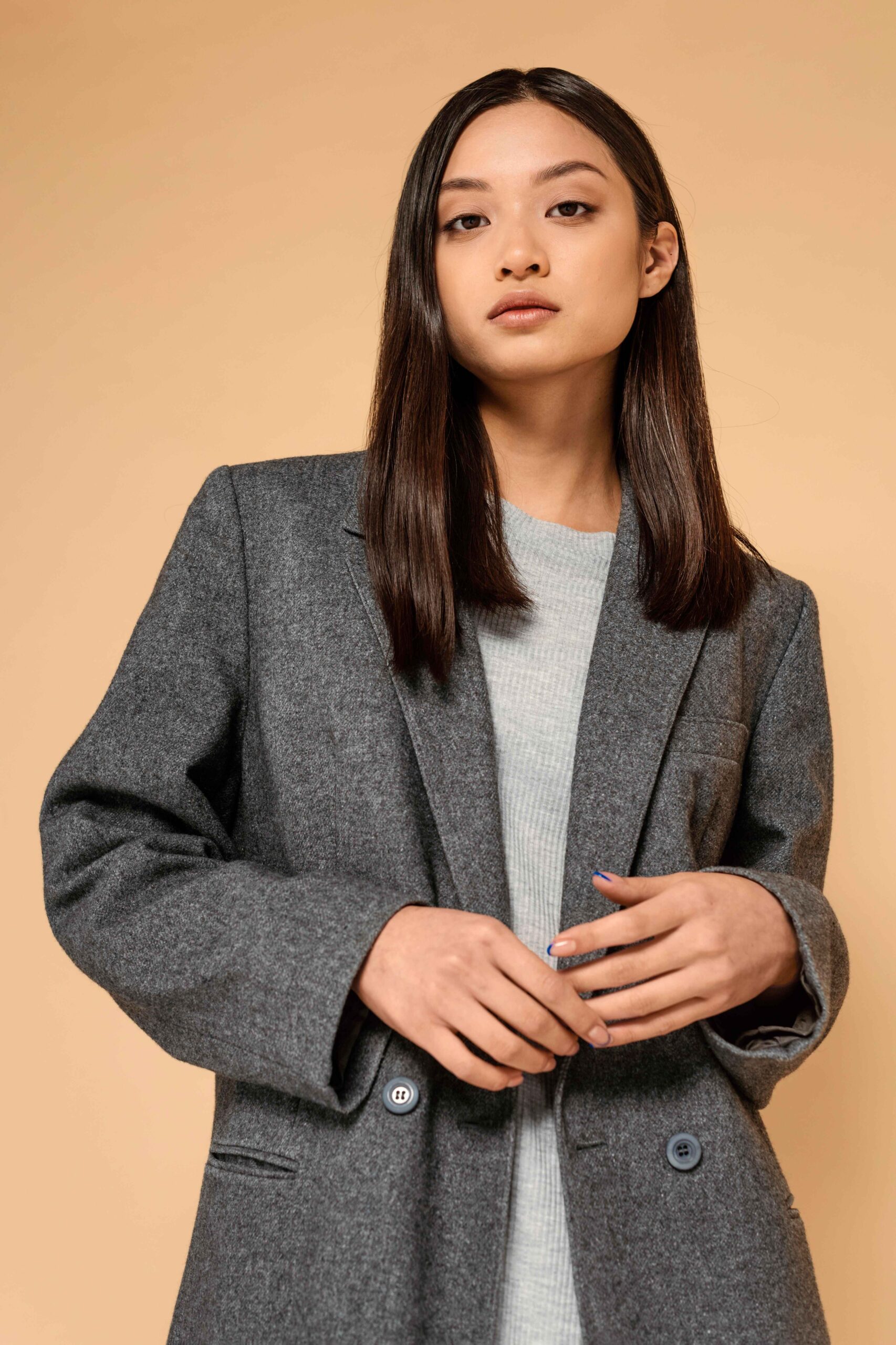 Girl wearing grey blazer